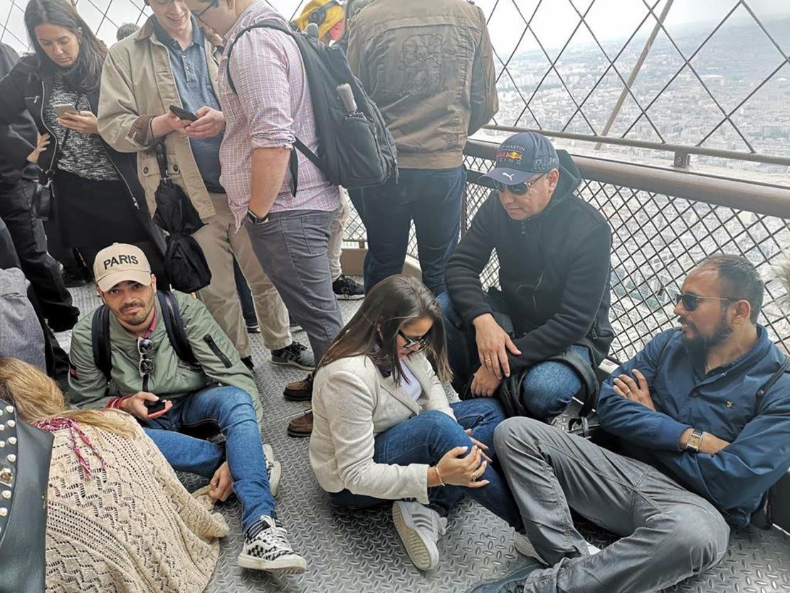People were stuck on the Eiffel Tower after a person scaled the landmark.