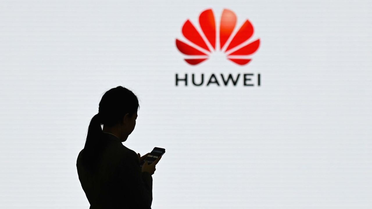 A staff member of Huawei uses her mobile phone at the Huawei Digital Transformation Showcase in Shenzhen, China's Guangdong province on March 6, 2019. - Chinese telecom giant Huawei insisted on March 6 its products feature no security "backdoors" for the government, as the normally secretive company gave foreign media a peek inside its state-of-the-art facilities. (Photo by WANG ZHAO / AFP)        (Photo credit should read WANG ZHAO/AFP/Getty Images)