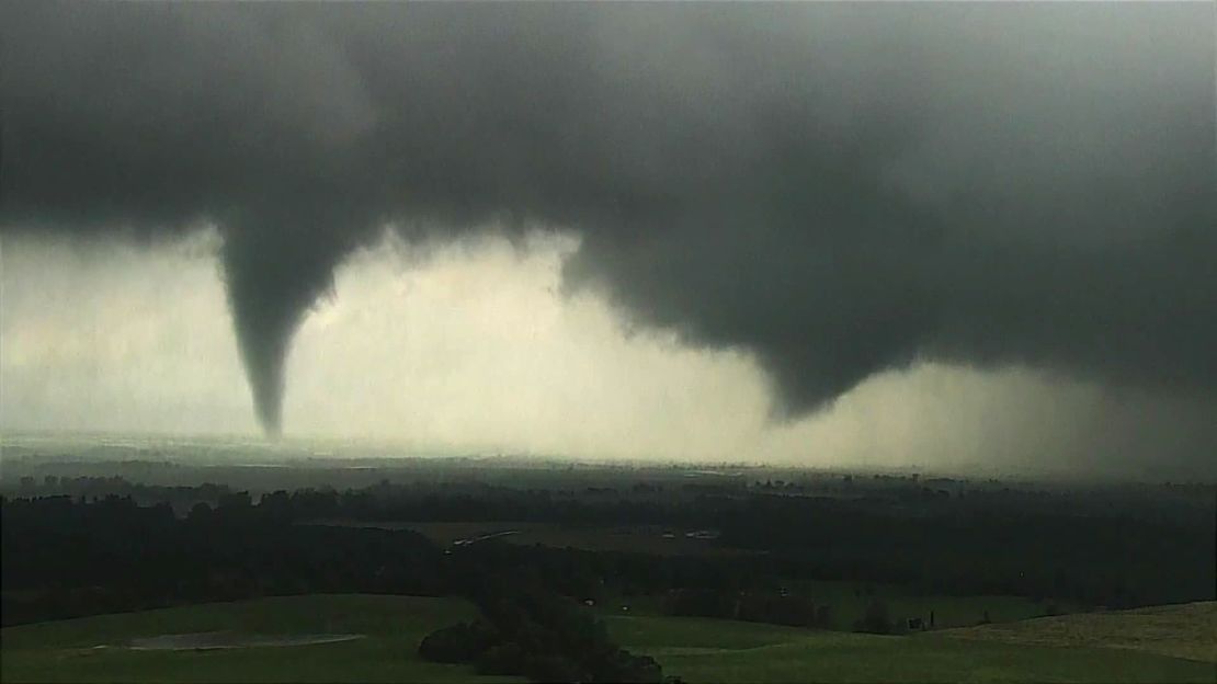 A tornado, left, and a funnel cloud take shape near Crescent, Oklahoma. Both became tornadoes, according to CNN Weather. 