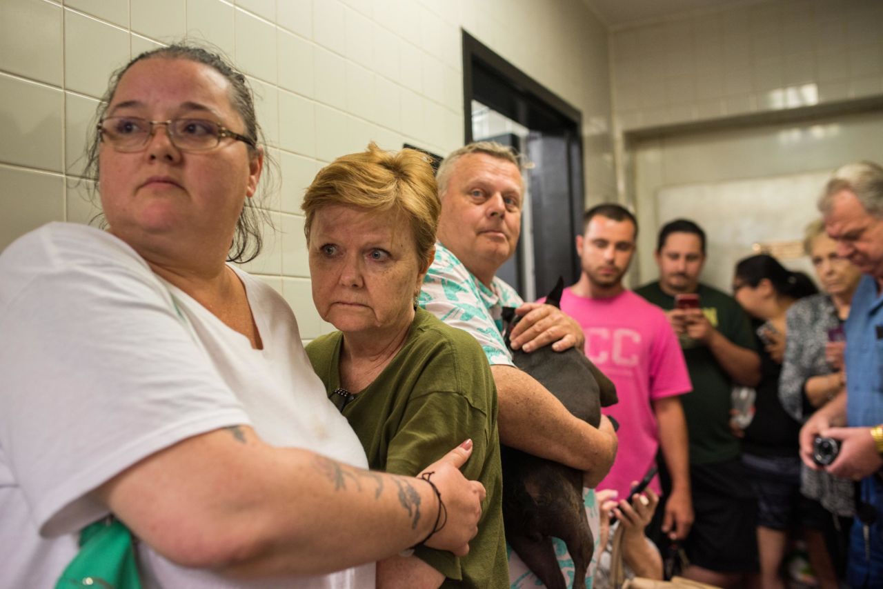 Scared travelers huddle in the back of a gas station for about 15 minutes as doors shook and heavy winds and rain rattled the small building on Monday, May 20. 