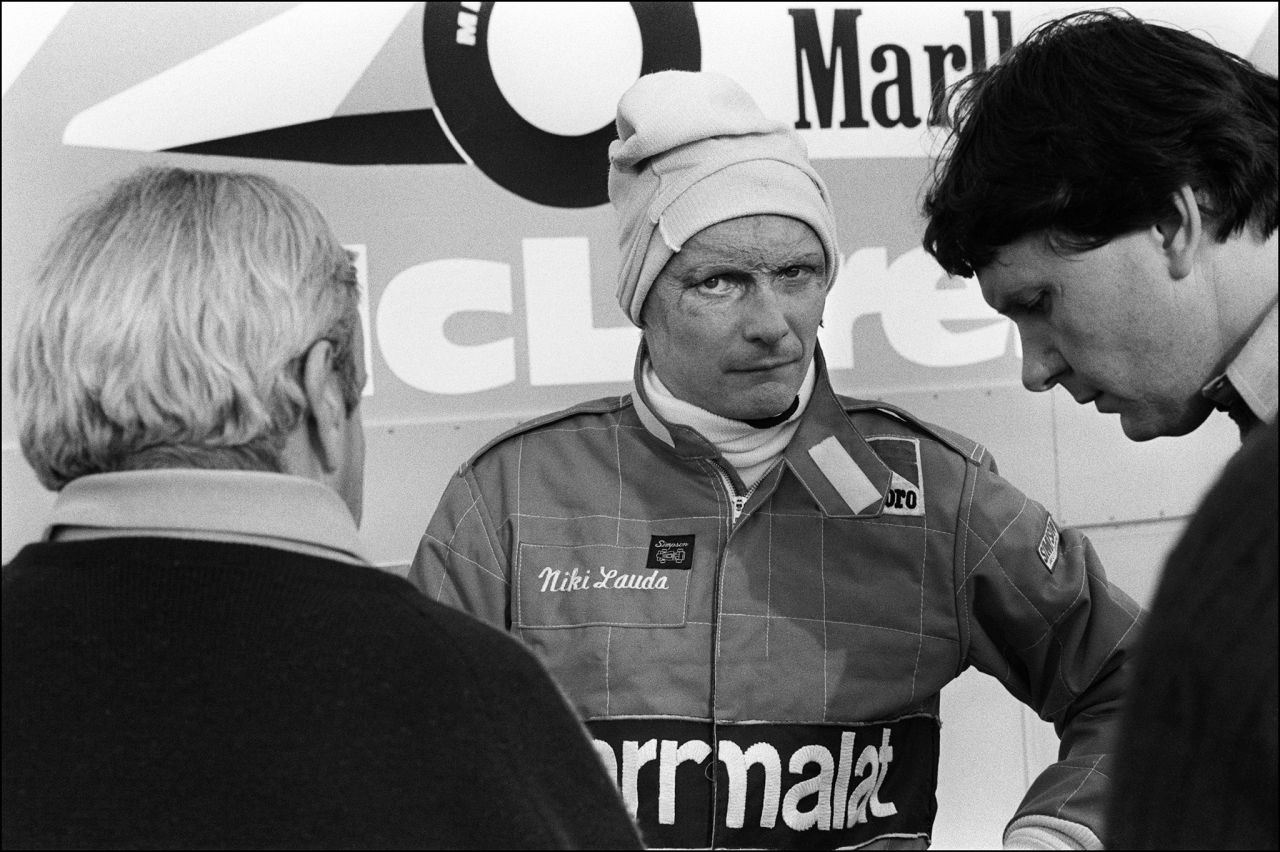Lauda, center, talks to members of the McLaren racing stable on the Le Castellet racing circuit on November 20, 1981.