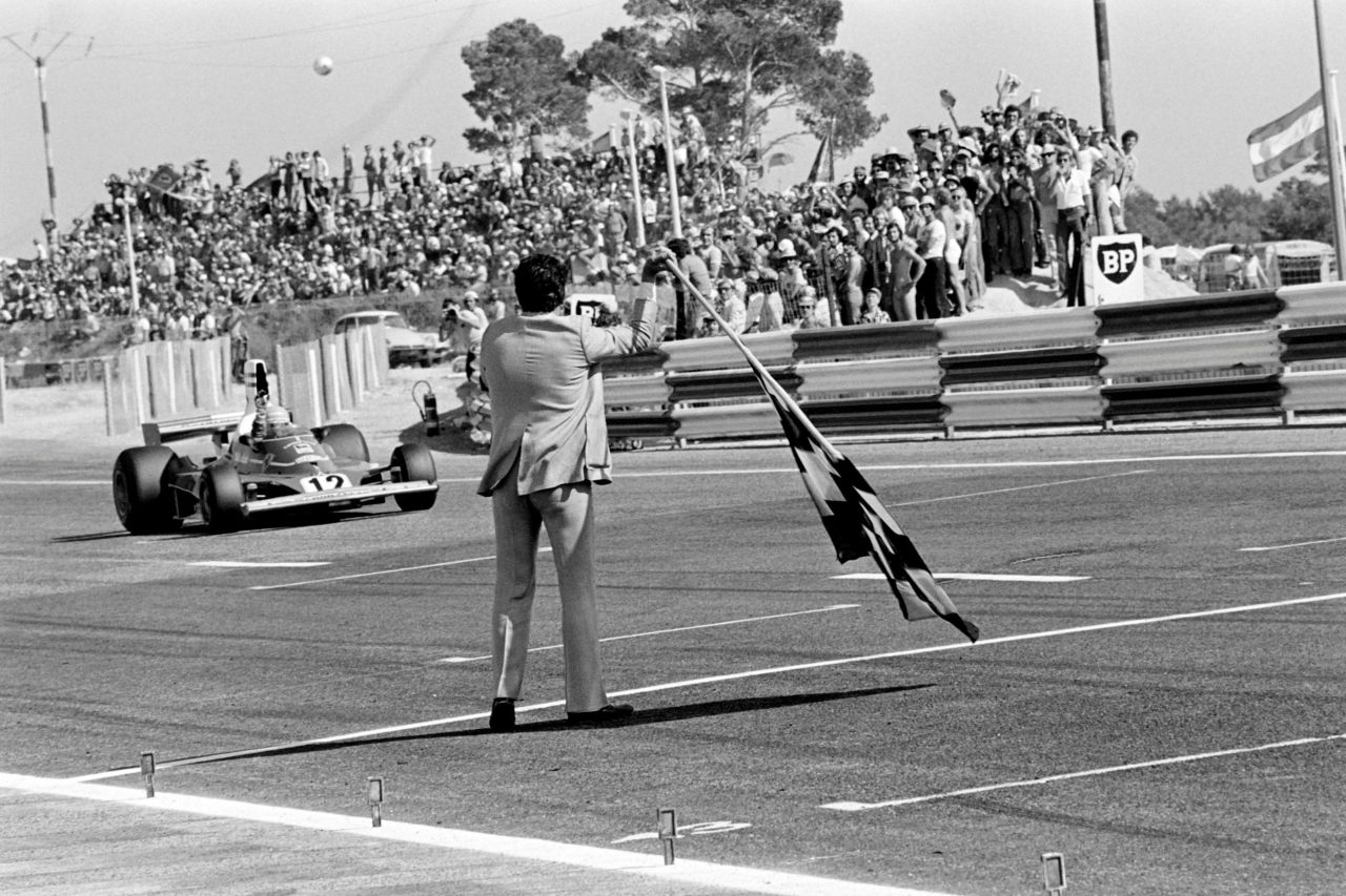 Lauda crosses the finish line of the French Grand Prix in his Ferrari 312 T at the Circuit Paul Ricard on July 6, 1975.