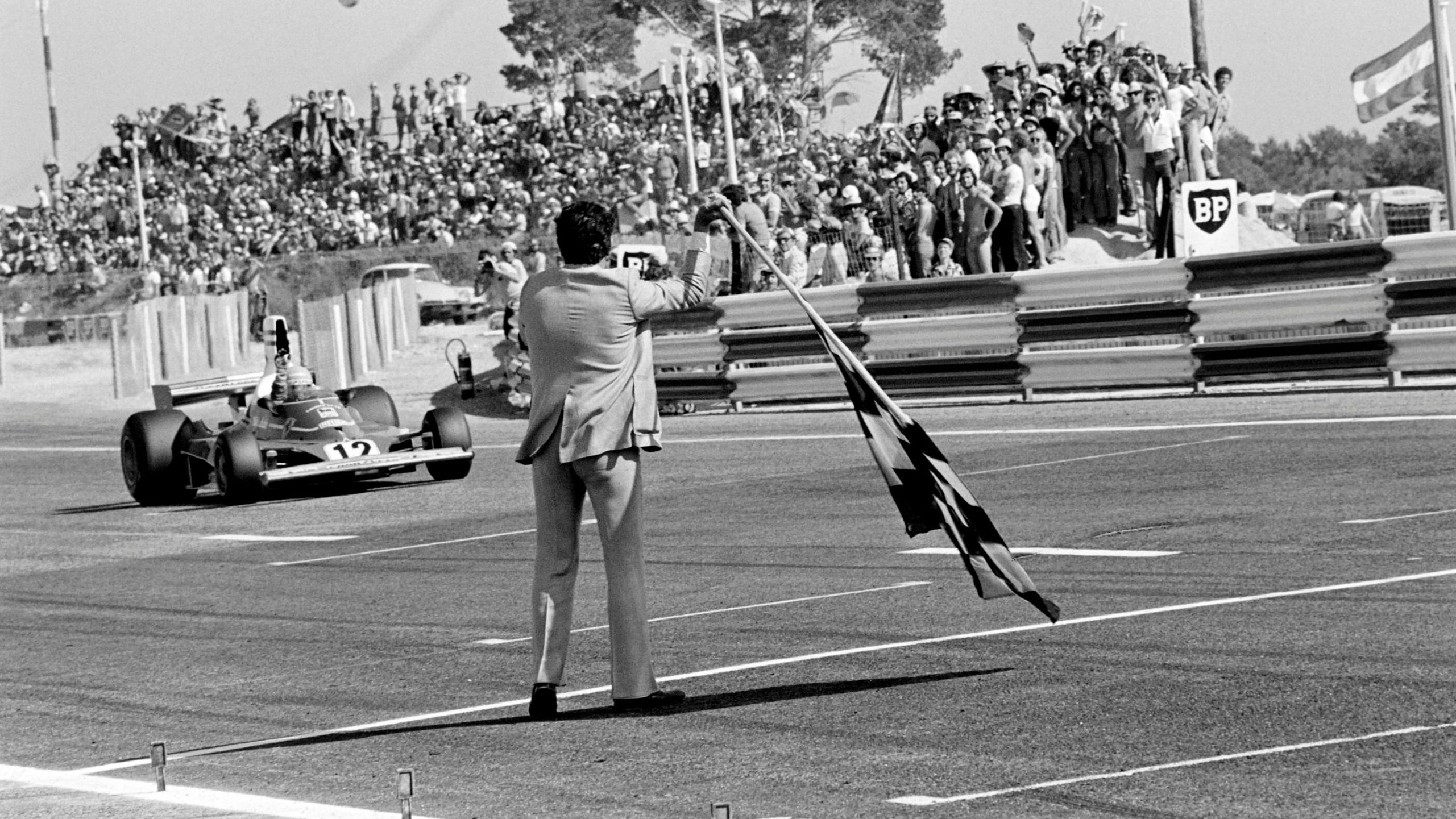 Lauda crosses the finish line of the French Grand Prix in his Ferrari 312 T at the Circuit Paul Ricard on July 6, 1975.