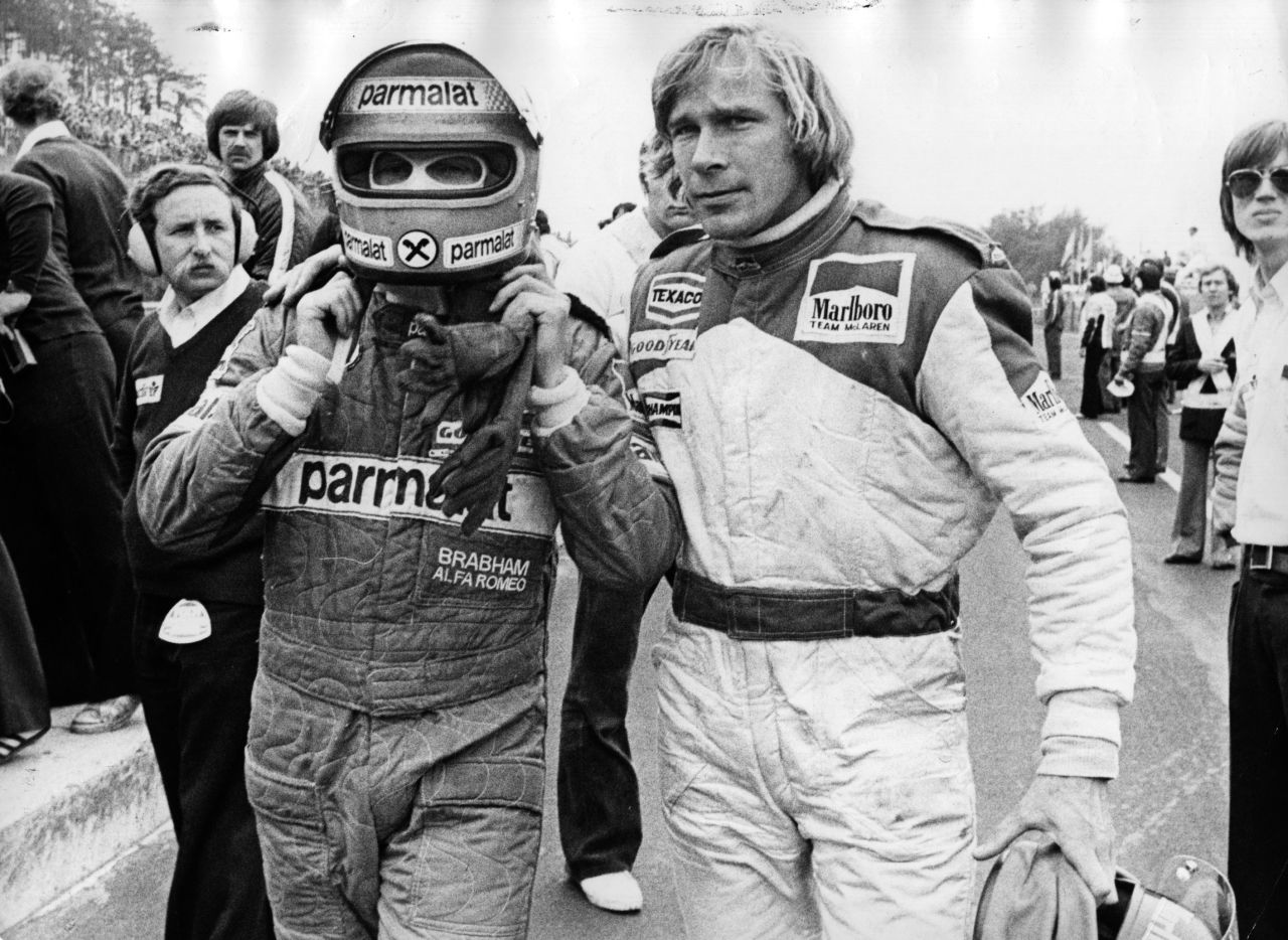 Lauda, left, and British racing driver James Hunt abandon a race after crashing into one other.