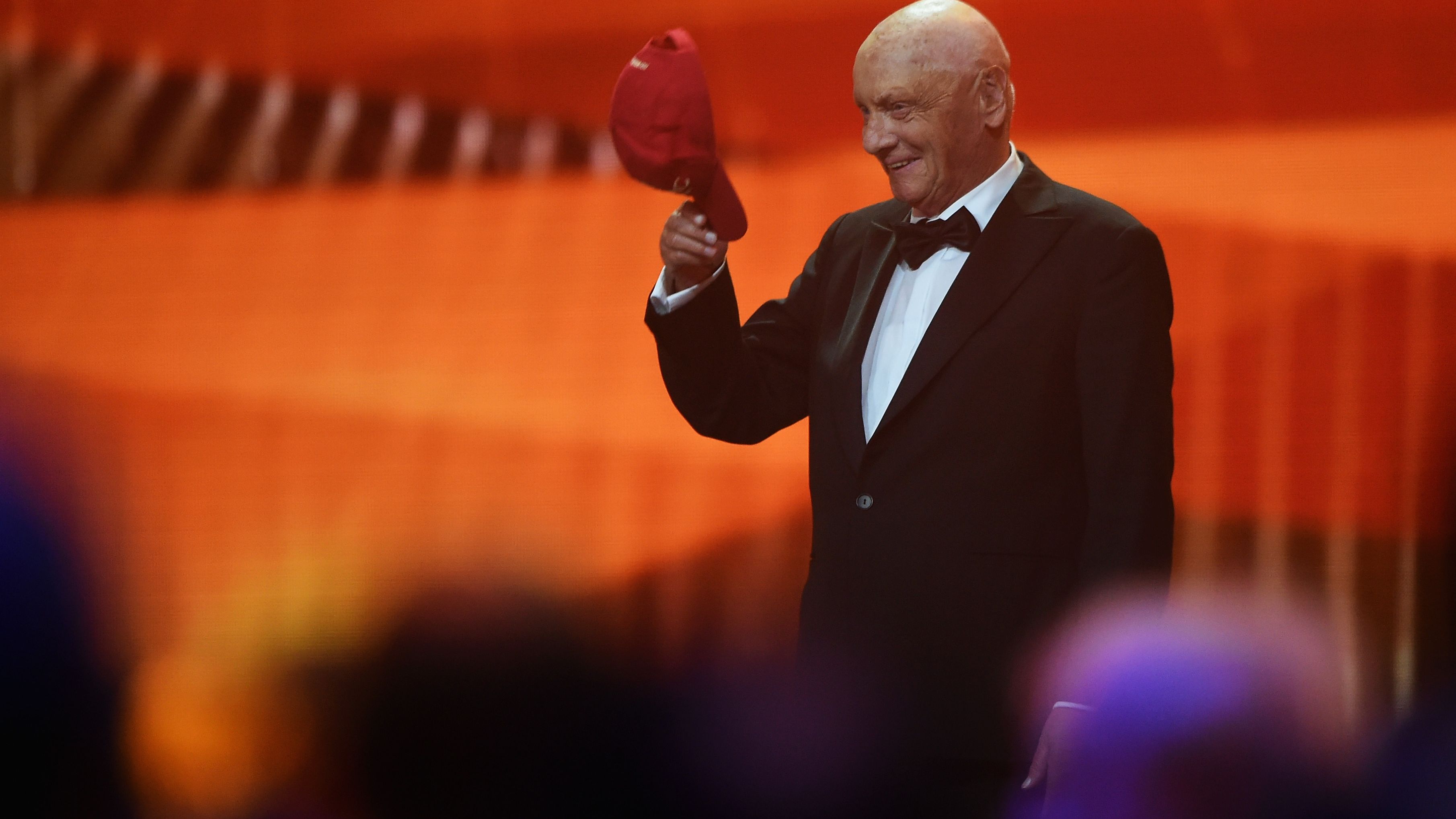 Lauda takes his cap off after the announcement of his Laureus Lifetime Achievement Award during the 2016 Laureus World Sports Awards at the Messe Berlin on April 18, 2016 in Berlin, Germany.