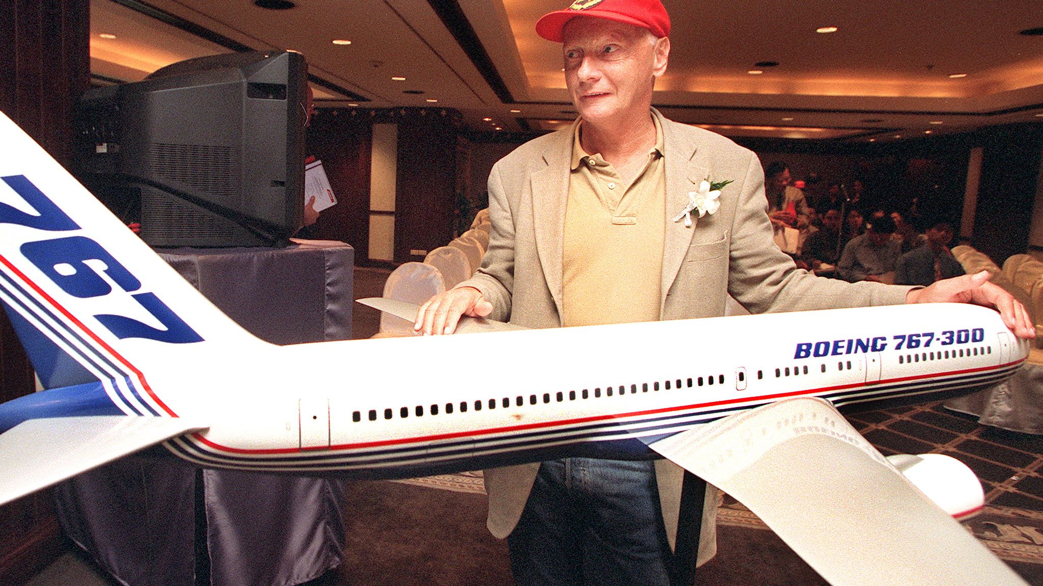 Lauda poses with a model of a Boeing 767 in Bangkok on September 1, 1999. Lauda flew the 767, with 100 passengers aboard, to Bangkok on the first leg of a twelve-day voyage around the world.