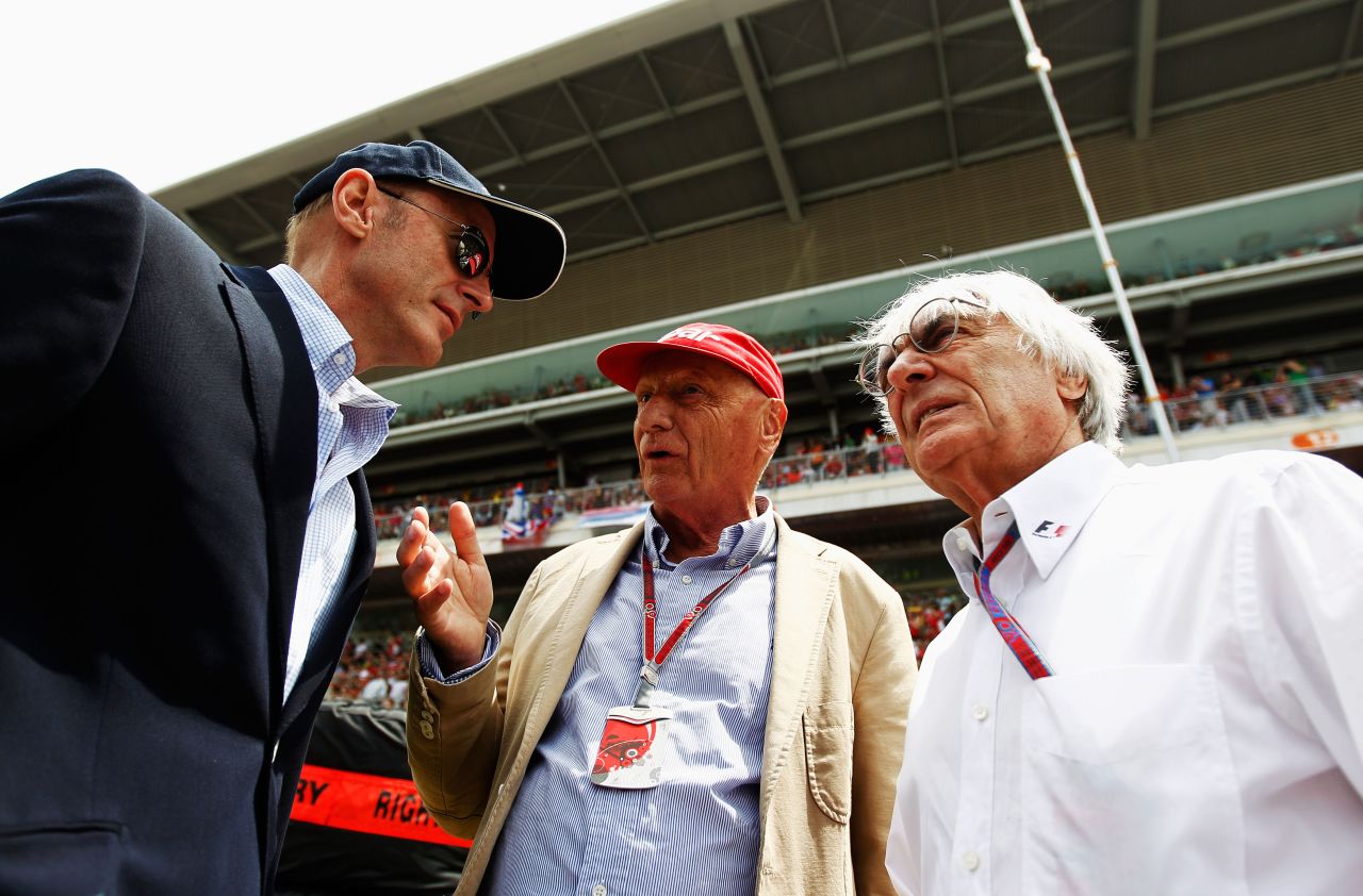 Lauda, center, talks with Donald MacKenzie of CVC Capital Partners, left, and F1 supremo Bernie Ecclestone, right, before the Spanish Formula One Grand Prix at the Circuit de Catalunya on May 13, 2012 in Barcelona, Spain.