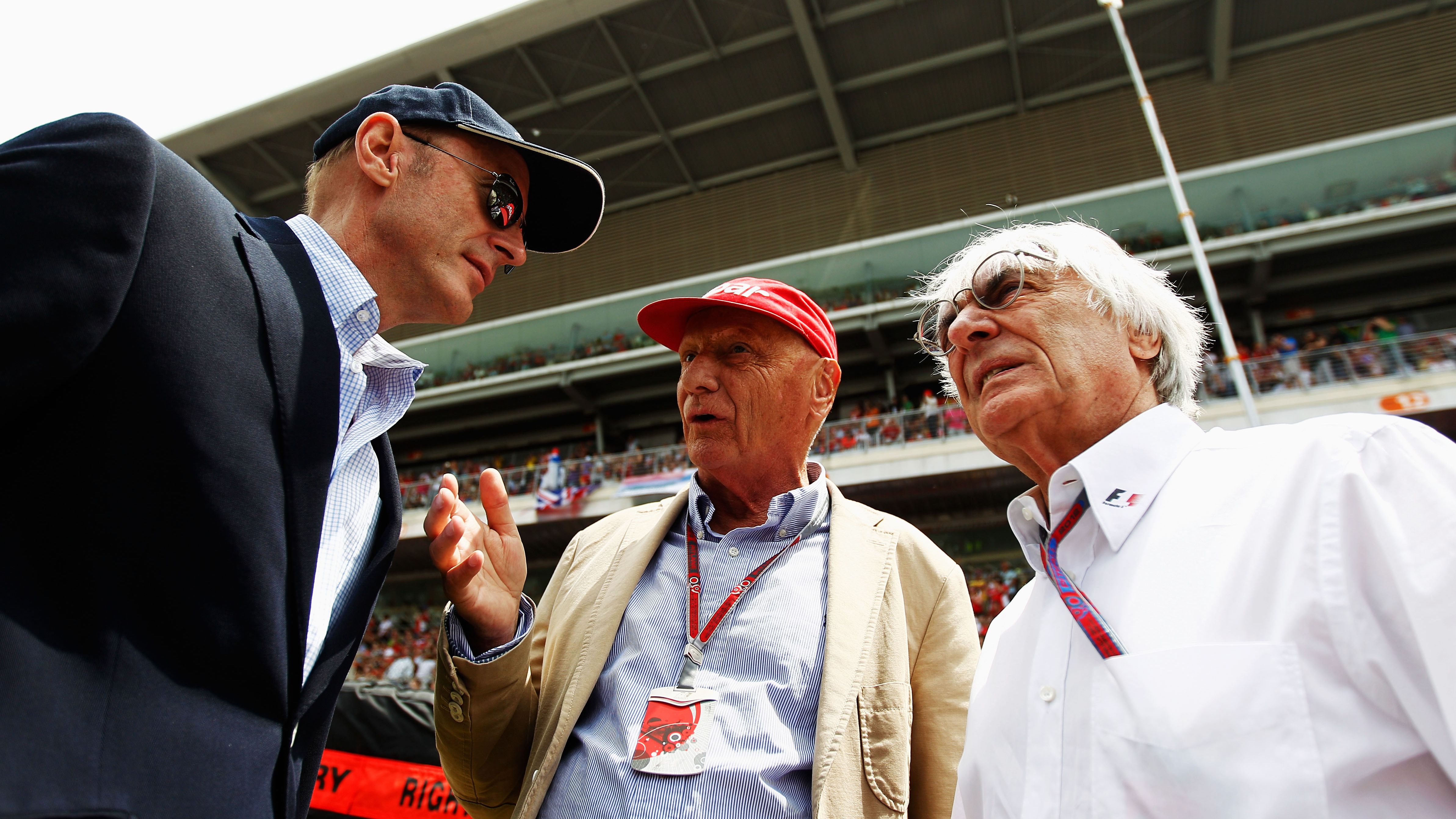 Lauda, center, talks with Donald MacKenzie of CVC Capital Partners, left, and F1 supremo Bernie Ecclestone, right, before the Spanish Formula One Grand Prix at the Circuit de Catalunya on May 13, 2012 in Barcelona, Spain.