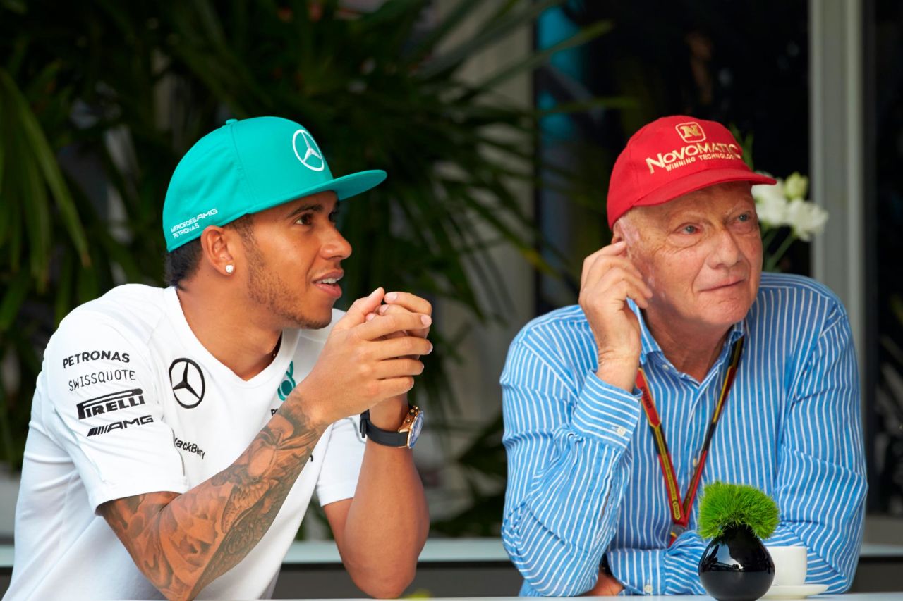 Lauda talks with Lewis Hamilton of Great Britain and Mercedes GP before practice for the Malaysia Formula One Grand Prix at the Sepang Circuit on March 28, 2014 in Kuala Lumpur, Malaysia.
