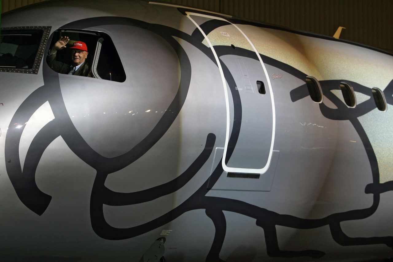 Lauda waves from the cockpit of the first 'Legacy 190' executive jet during a delivering ceremony to Niki airlines, at Embraer's headquarters, in Sao Jose dos Campos, north of Sao Paulo, Brazil, on May 14, 2009.