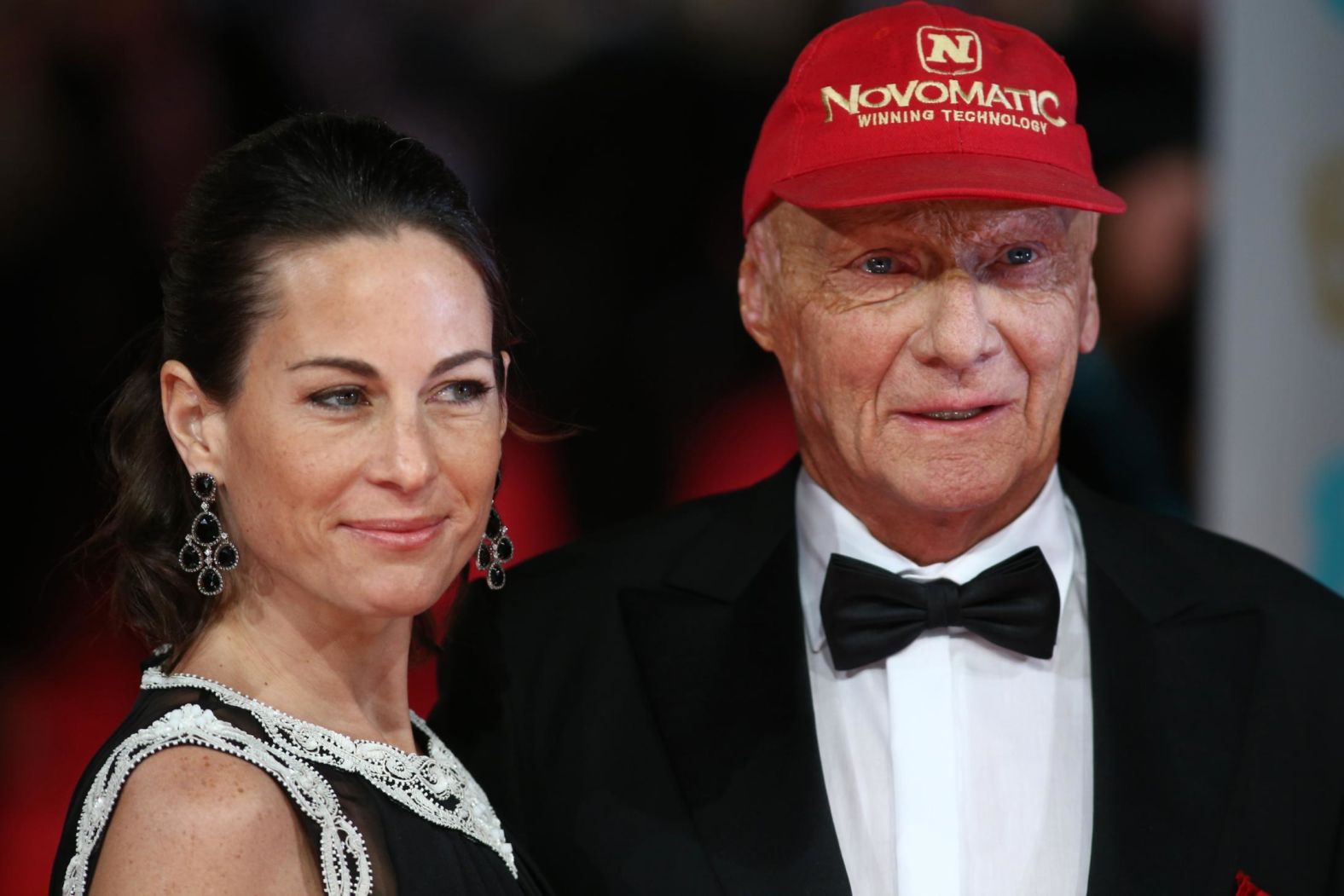 Lauda poses with his wife Birgit on the red carpet for the British Academy Film Awards at the Royal Opera House in London on February 16, 2014.