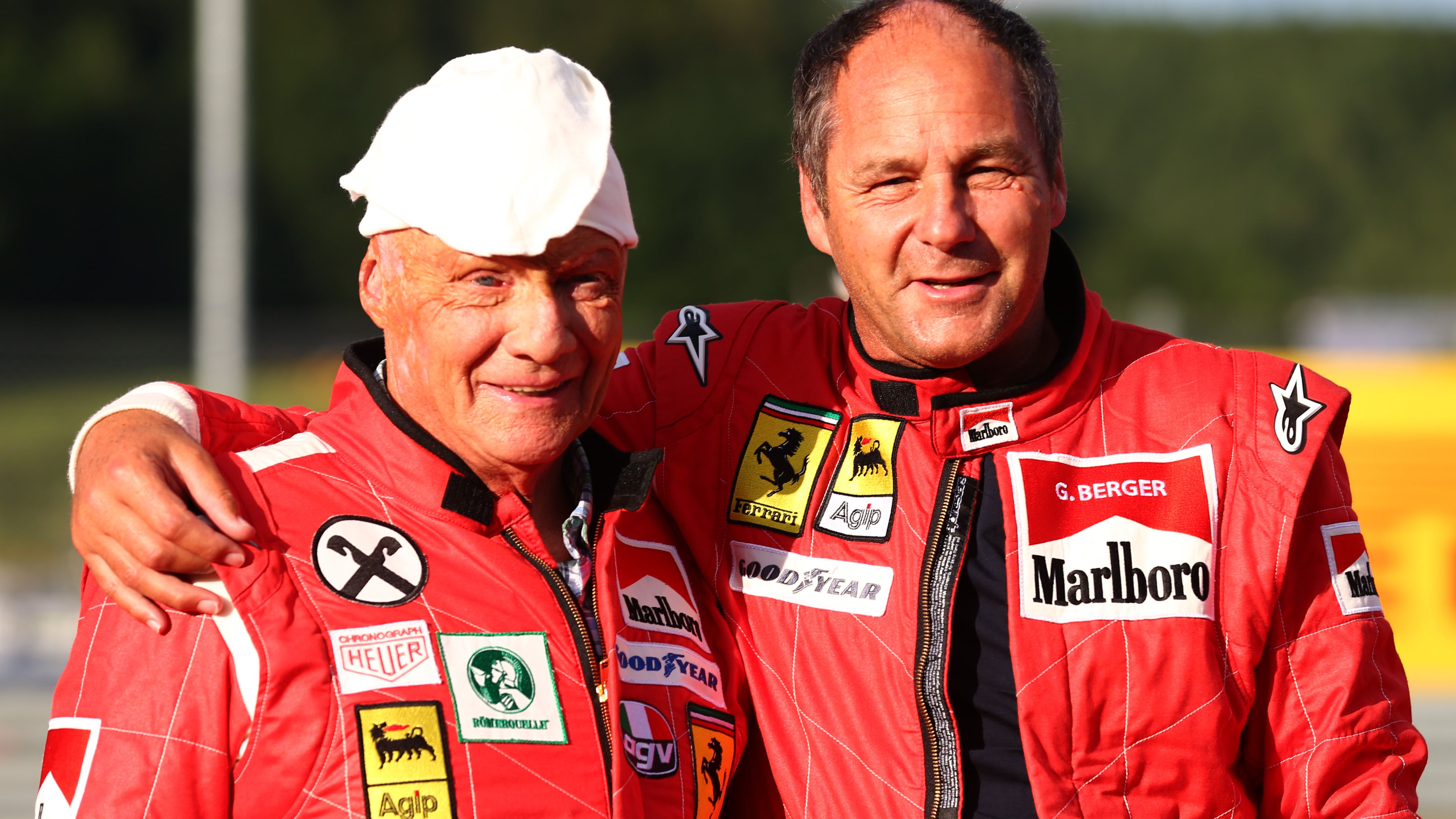 Lauda, a non-executive chairman of Mercedes GP, poses with former driver Gerhard Berger after qualifying ahead of the Austrian Formula One Grand Prix at Red Bull Ring on June 21, 2014 in Spielberg, Austria.
