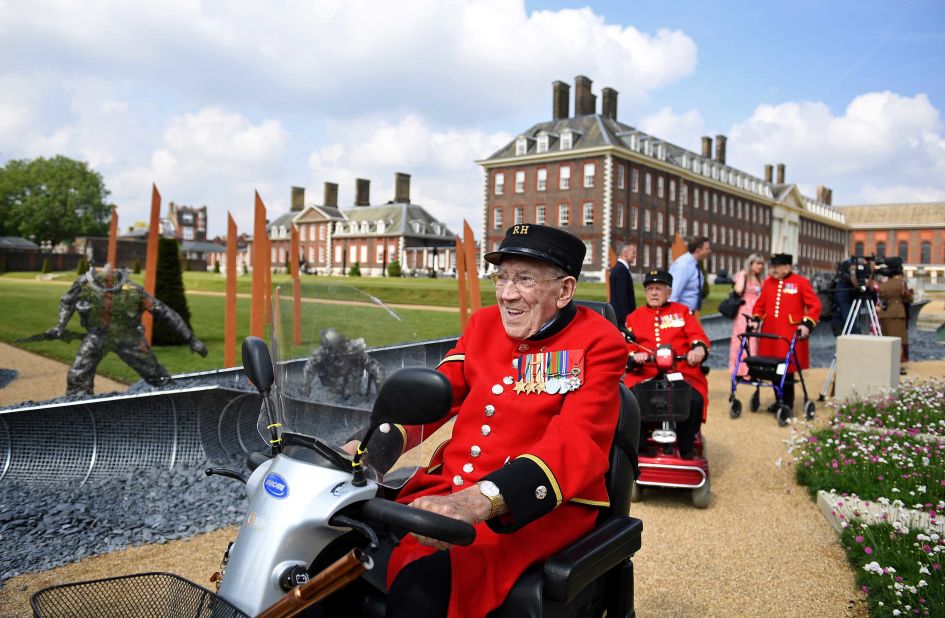 Chelsea Pensioners and war veterans tour the "D-Day 75" garden, designed by John Everiss as a tribute to the heroes of the World War II D-Day landings.