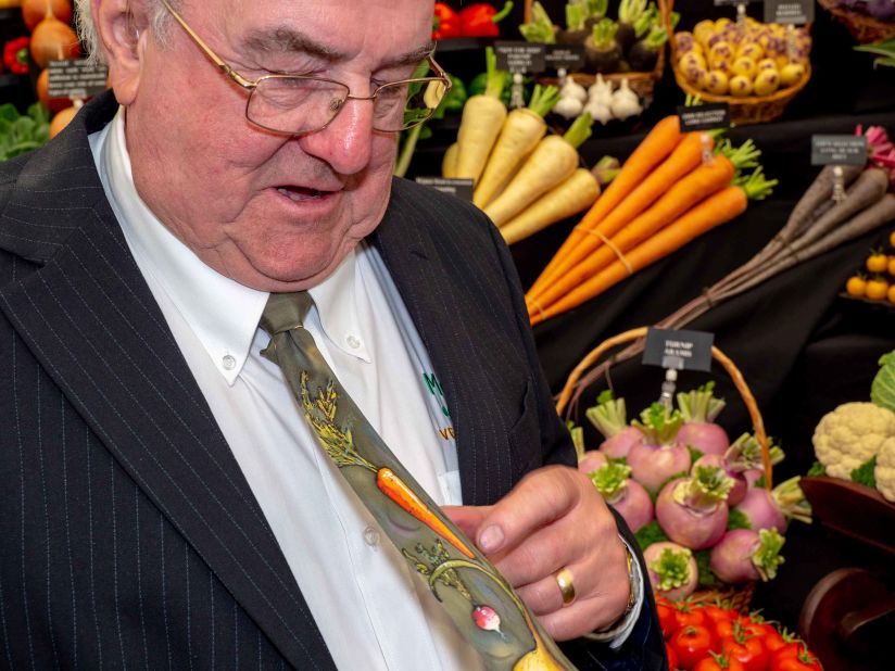 A vendor dons a vegetable-themed tie.