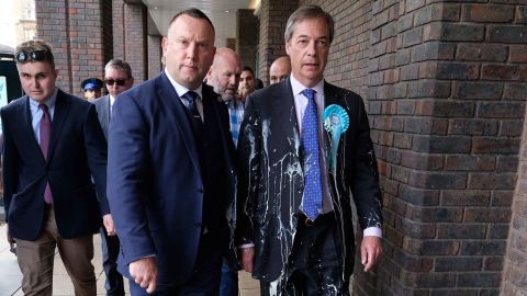 Brexit Party leader Nigel Farage (right) had a milkshake thrown at him while campaigning last month.