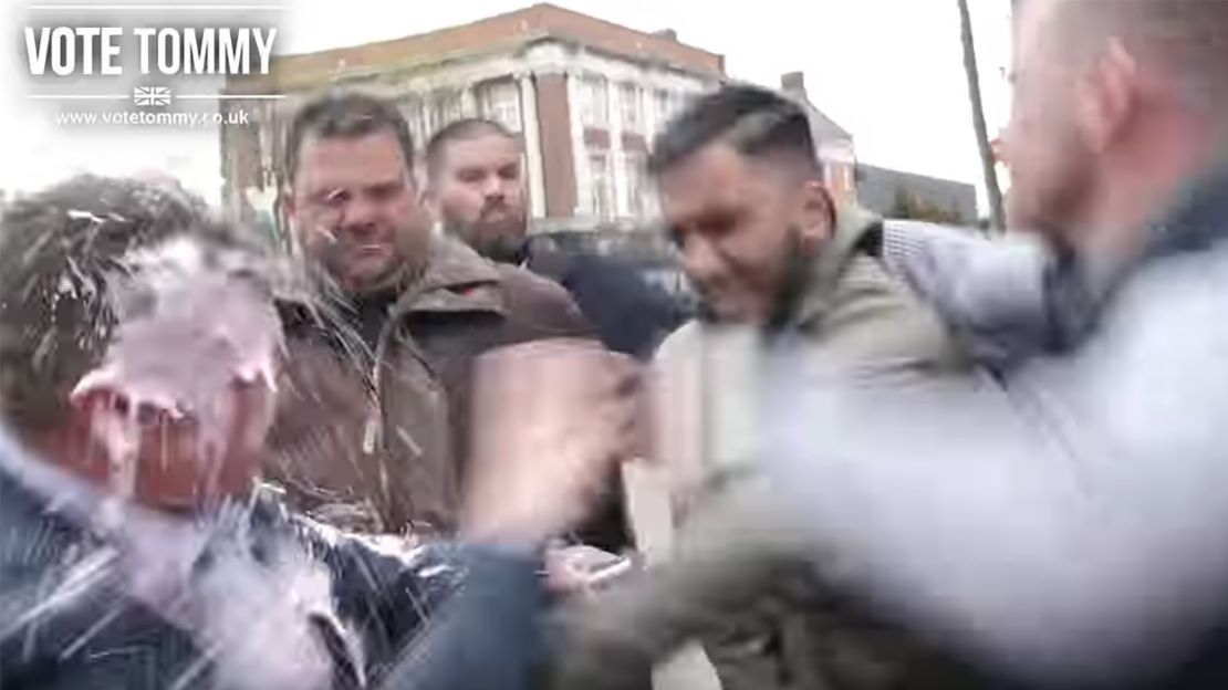 A grab from a Tommy Robinson promotional video on Youtube shows Robinson getting 'milkshaked.'