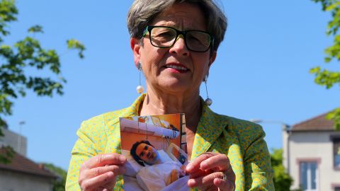 Viviane Lambert, Vincent's mother, holds a picture of her son on life support in 2015.