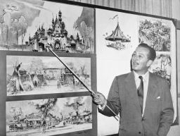 Walt Disney points to sketches of Sleeping Beauty's Castle in 1955, four years before the company released the animated film. 