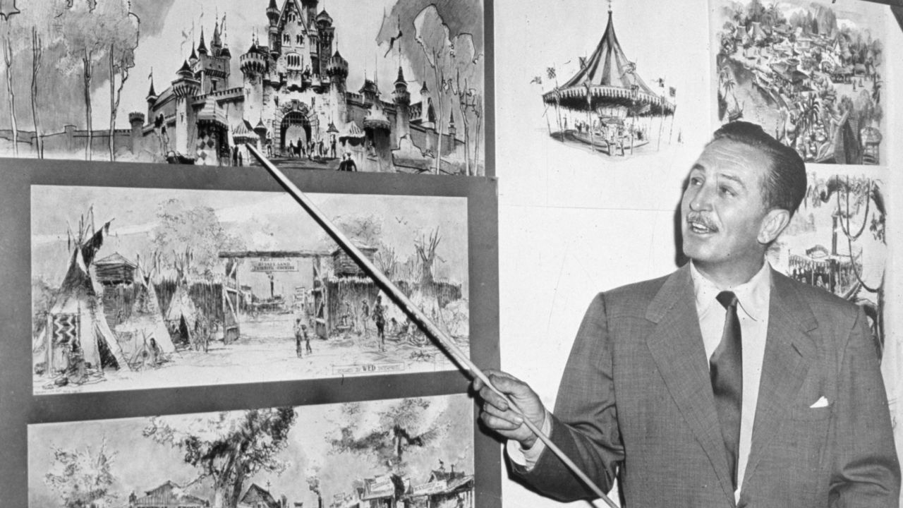 Walt Disney points to sketches of Sleeping Beauty's Castle in 1955, four years before the company released the animated film.