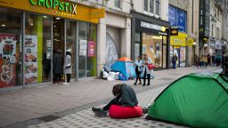 CARDIFF, UNITED KINGDOM - JANUARY 03: A man sits with his head in his hands in front of a tent on Queen Street on January 3, 2019 in Cardiff, United Kingdom. Nearly 600 homeless people in England and Wales died last year - a 24 percent rise over the past five years. Life expectancy is almost half that of people in stable housing, according to figures from the Office for National Statistics.(Photo by Matthew Horwood/Getty Images)