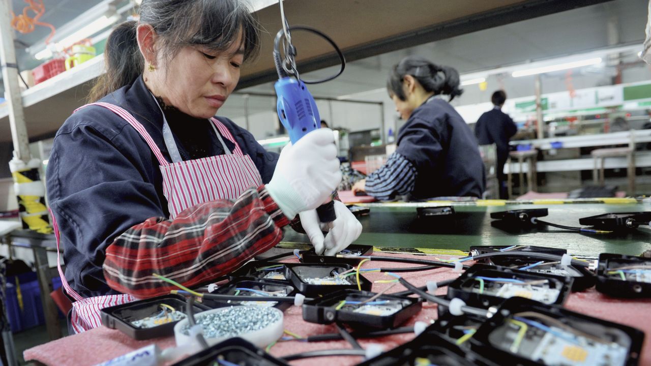 In this Saturday, March 30, 2019, file photo, workers assemble LED lights at a factory in Yushan county in central China's Jiangxi province. (AP Photo, File)