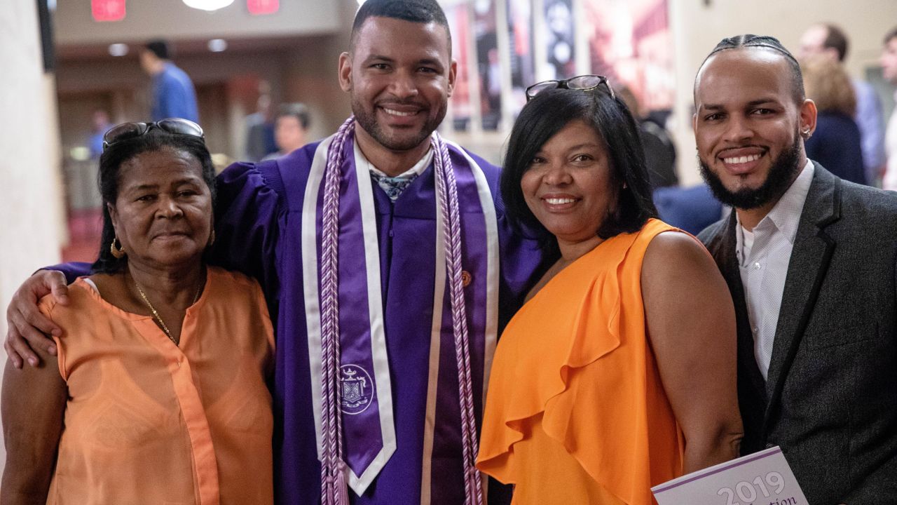Frank Baez celebrates with his family after graduating Monday from New York University Rory Meyers College of Nursing. He posed with his grandmother Tomasina De los Santos, left, his mom, Santa Marte, and his older brother Juan Baez.