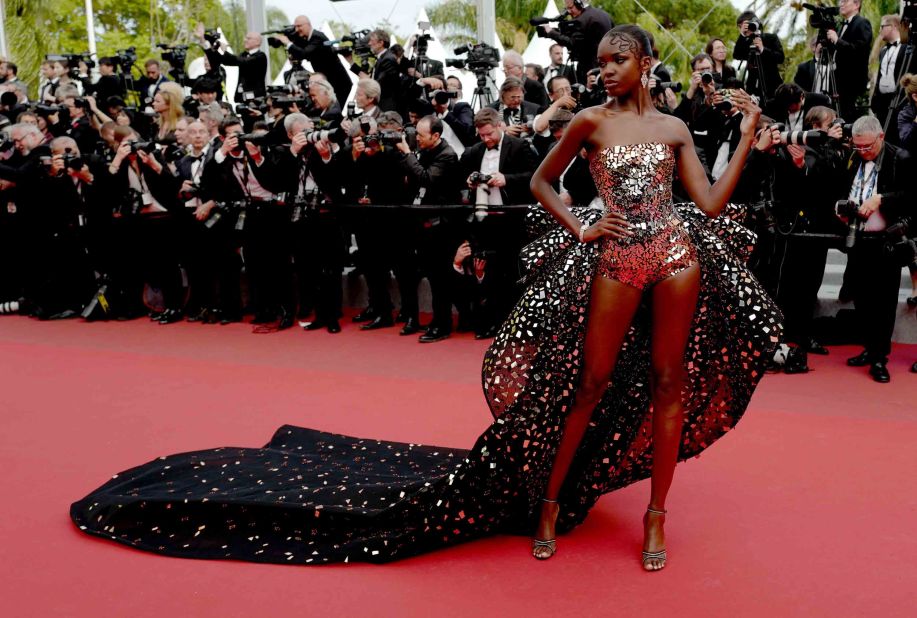 Ahead of the "Once Upon a Time... in Hollywood" screening, British model Leomie Anderson strikes a pose in a mirror-embellished Rami Kadi gown.