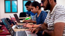 Indian undergraduate students code on their computers as they take part in HackCBS, a 24 hour event of software development also called 'hackathon', at the Shaheed Sukhdev College of Business Studies (SSCBS) in New Delhi on October 28, 2018. - Students from all over India gathered in teams to take part in a challenge to develop their ideas in the fields of Internet of Things (IoT), Artificial Intelligence (AI), Blockchain, Mobility and Education and Financial technology. (Photo by XAVIER GALIANA / AFP)        (Photo credit should read XAVIER GALIANA/AFP/Getty Images)