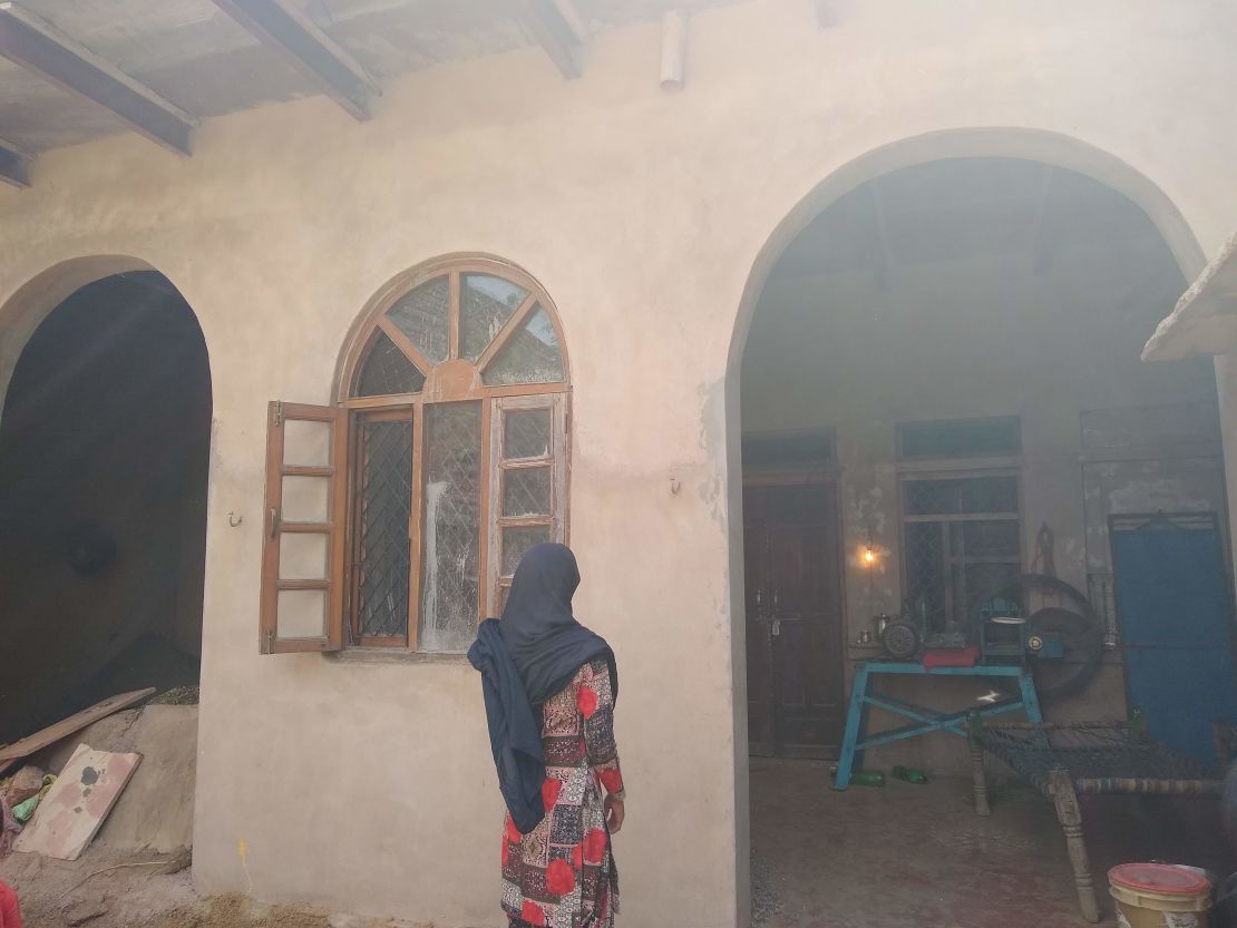 Sahila Khan, the 14-year-old daughter of Rakbar Khan, stands in front of her home in Kolgaon village in Haryana.