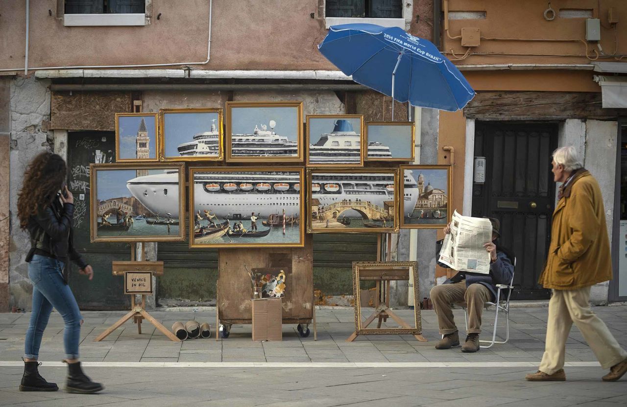 People pass by paintings in Venice, Italy, <a href="https://www.cnn.com/style/article/banksy-venice-biennale-scli-intl/index.html" target="_blank">that apparently are the work of the elusive street artist Banksy.</a> Banksy posted a video to Instagram that showed the stall being set up at the Venice Biennale. "Despite being the largest and most prestigious art event in the world, for some reason I've never been invited," <a href="https://www.instagram.com/p/BxxOKYflVSl/" target="_blank" target="_blank">Banksy wrote</a> on Wednesday, May 22.  