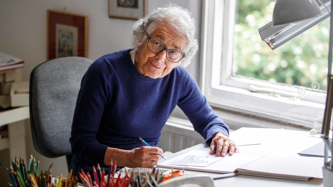 German-born British author and illustrator Judith Kerr, poses for a photograph at her home in west London on June 12, 2018. - As British author Judith Kerr celebrates turning 95 on Thursday, her famous children's book "The Tiger Who Came To Tea" remains the crowning achievement of a life devoted to writing and drawing after she fled Nazi Germany. The story chronicles Sophie and her mother, having tea in the kitchen when the doorbell rings. In steps a huge tiger who devours all the food and drink before never being seen again. "It was a bedtime story I made up for my daughter who was then three," said the nonagenarian, with curly grey hair and a mischievous smile, in the living room of her south west London brick house where she raised two children. (Photo by Tolga Akmen / AFP) / TO GO WITH AFP STORY by Pauline FROISSART        (Photo credit should read TOLGA AKMEN/AFP/Getty Images)
