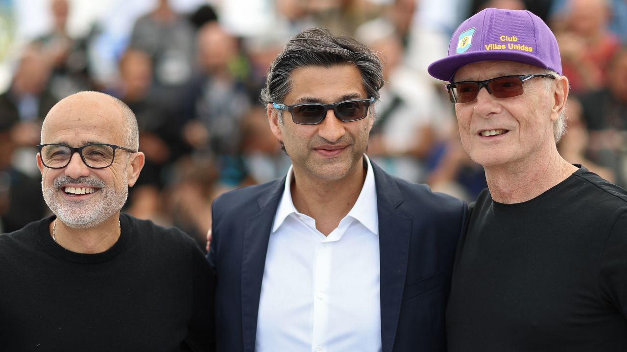 Argentinian journalist Daniel Arcucci, British director Asif Kapadia and Maradona's former fitness coach Fernando Signorini pose during a photocall for the film "Diego Maradona" at the 72nd edition of the Cannes Film Festival.