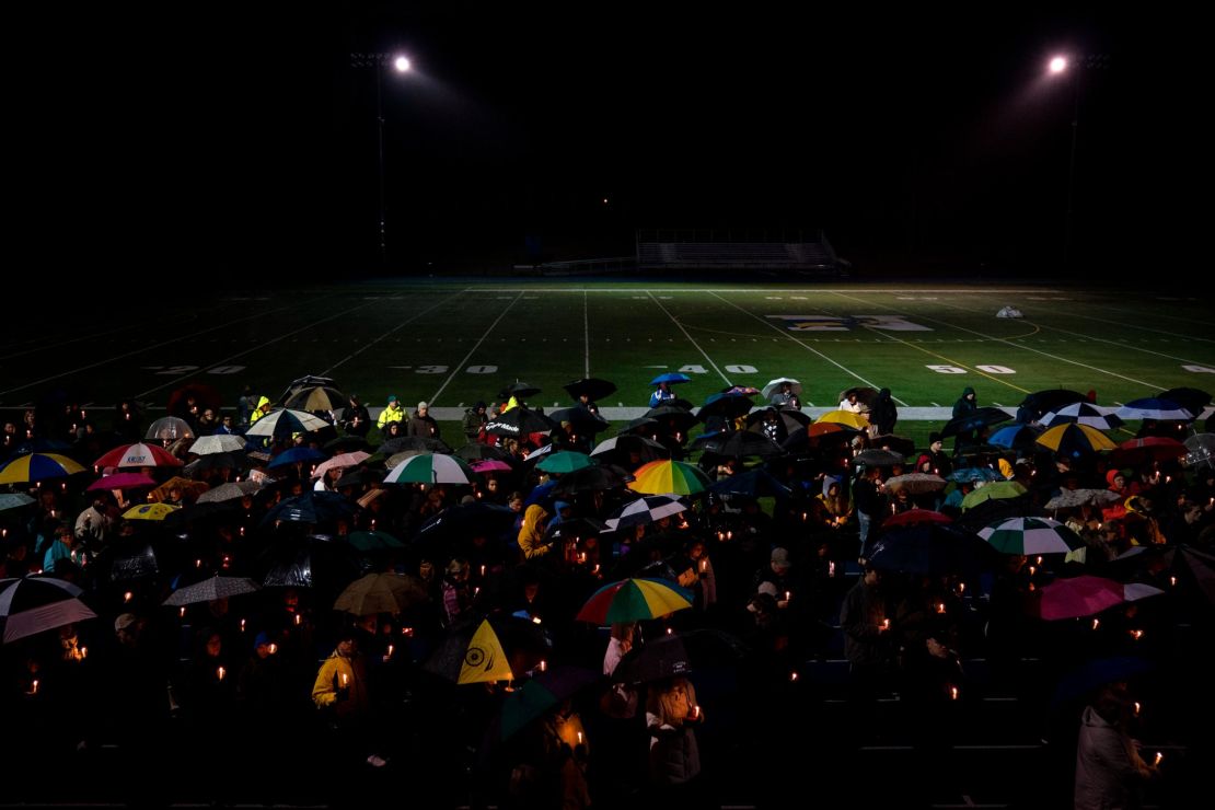 Mourners at a community vigil at Newtown High School for the victims of the mass shooting at Marjory Stoneman Douglas High School in Parkland, Florida in 2018.
