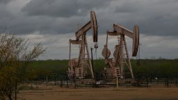 Pump jacks at an oil extraction site on March 12, 2019, in Cotulla, Texas. (Photo by Loren ELLIOTT / AFP)        (Photo credit should read LOREN ELLIOTT/AFP/Getty Images)