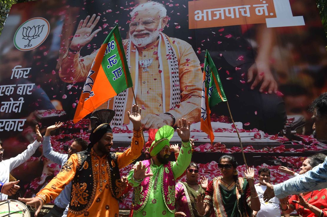 BJP supporters celebrate the election results outside the party's headquarters in Mumbai.