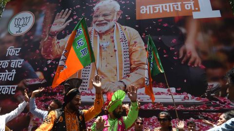 BJP supporters celebrate the election results outside the party's headquarters in Mumbai.