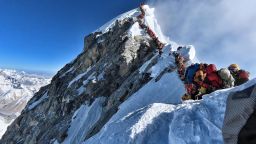 This handout photo taken on May 22, 2019, and released by climber Nirmal Purja's Project Possible expedition shows heavy traffic of mountain climbers lining up to stand at the summit of Mount Everest. 