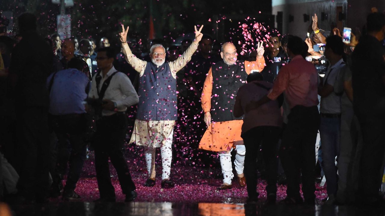 Indian Prime Minister Narendra Modi and BJP President Amit Shah celebrate the BJP's election win.
