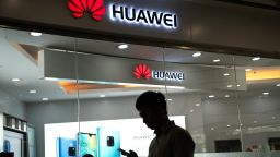 A man walks past a Huawei logo displayed at a retail store in Beijing on May 23, 2019. - Chinese telecom giant Huawei says it could roll out its own operating system for smartphones and laptops in China by the autumn after the United States blacklisted the company, a report said on May 23. (Photo by FRED DUFOUR / AFP)        (Photo credit should read FRED DUFOUR/AFP/Getty Images)