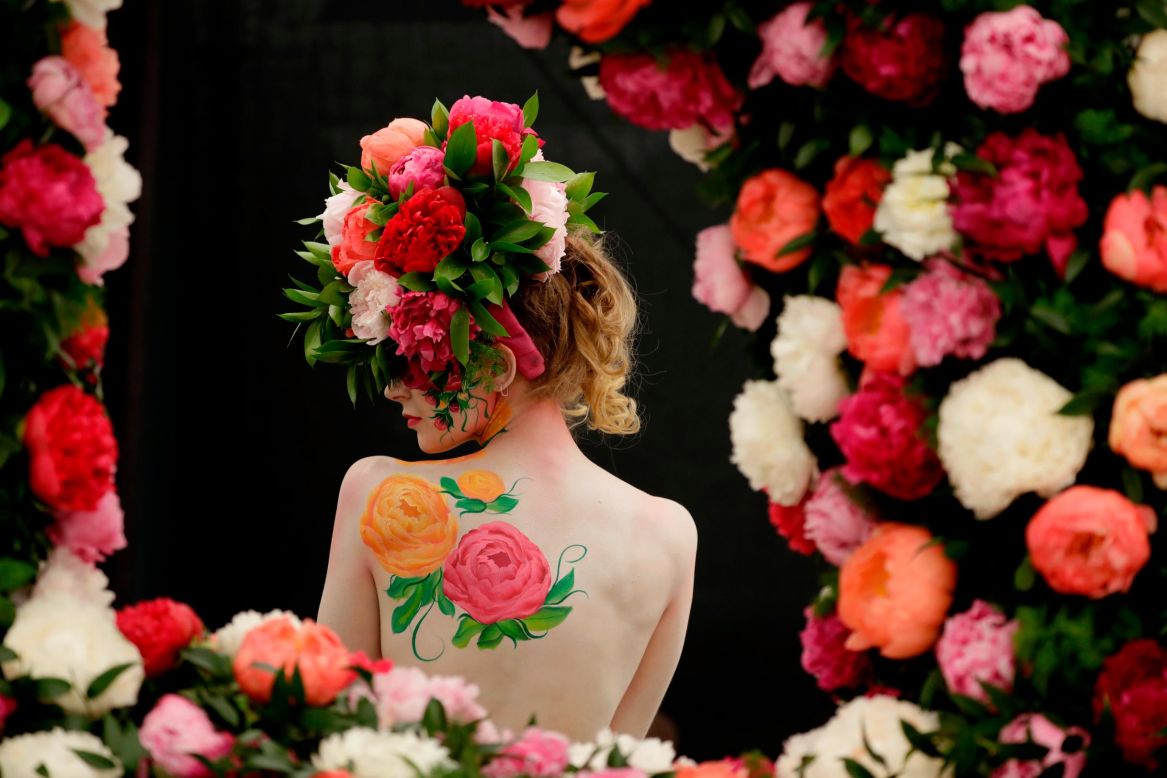 A model poses with body paint Monday, May 20, ahead of the <a href="https://www.cnn.com/2019/05/21/world/gallery/chelsea-flower-show-2019-intl/index.html" target="_blank">Chelsea Flower Show</a> in London. The show, now in its 107th year, is the world's most prestigious and anticipated horticultural event.