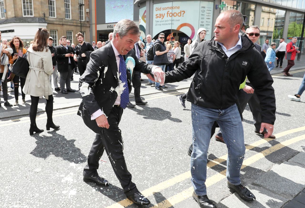 Brexit Party leader Nigel Farage is helped after being hit with a milkshake in Newcastle, England, on Monday, May 20. Several right-wing British politicians <a href="https://www.cnn.com/2019/05/21/uk/milkshake-analysis-mcgee-intl-gbr/index.html" target="_blank">have had milkshakes thrown at them this month.</a>