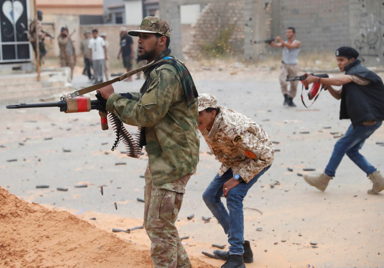 Fighters loyal to Libya's UN-backed government fire weapons during clashes with forces loyal to renegade general Khalifa Haftar on Tuesday, May 21. Eight years after the fall of strongman leader Moammar Gadhafi, <a href="https://www.cnn.com/2019/04/24/africa/gallery/battle-in-tripoli-libya/index.html" target="_blank">Libya is mired in violence</a> and split into rival administrations.