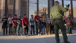Migrants, mostly from Central America, que to board a van which will take them to a processing center, on May 16, 2019, in El Paso, Texas. - About 1,100 migrants from Central America and other countries are crossing into the El Paso border sector each day. US Customs and Border Protection Public Information Officer Frank Pino, says that Border Patrol resources and personnel are being stretched by the ongoing migrant crisis, and that the real targets of the Border Patrol are slipping through the cracks. (Photo by Paul Ratje / AFP)        (Photo credit should read PAUL RATJE/AFP/Getty Images)