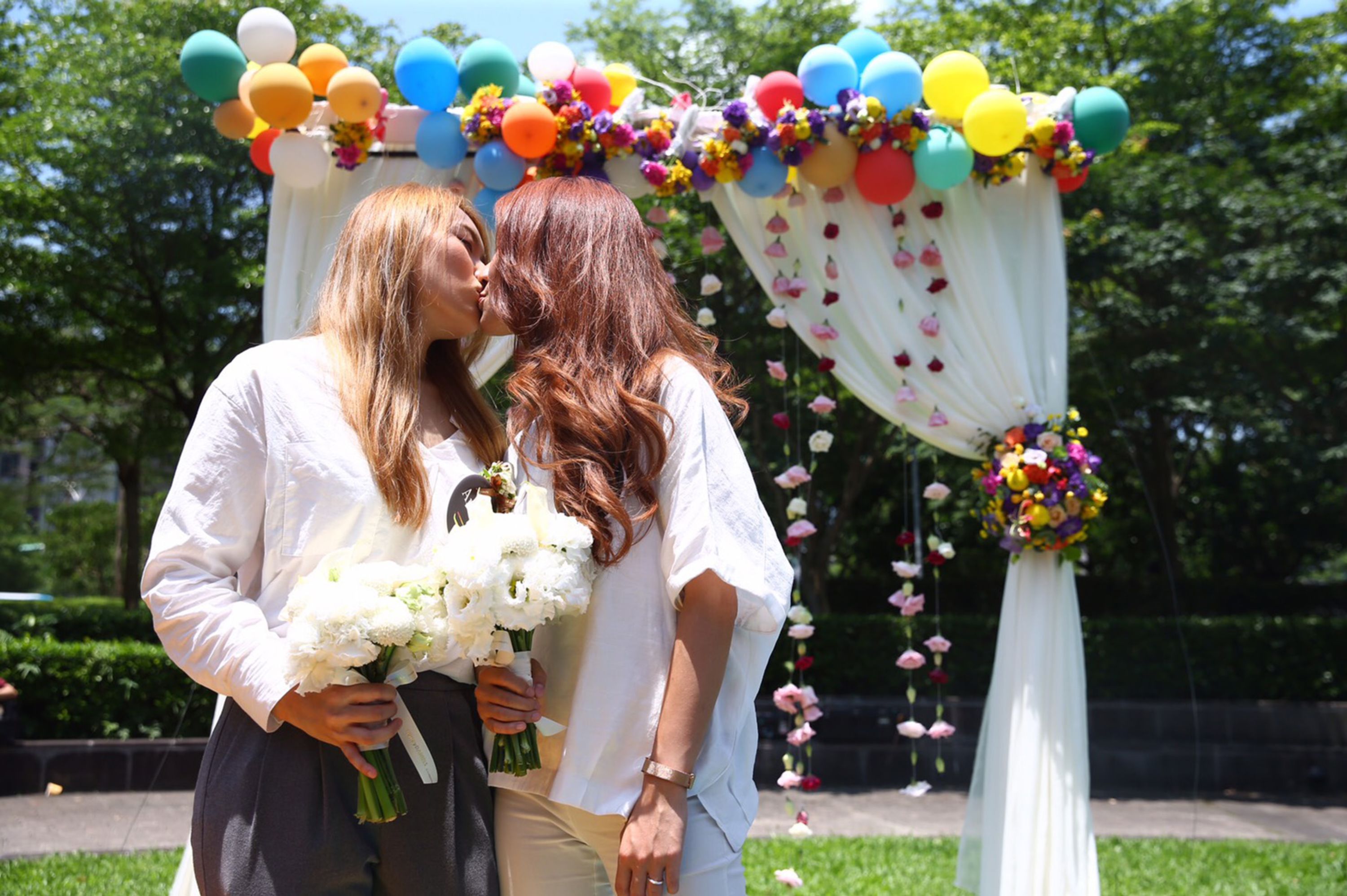 Amber Wang, left, and Kristin Huang, right, kiss during their wedding just days after Taiwan passed historical same-sex marriage law, making it the first nation in Asia.