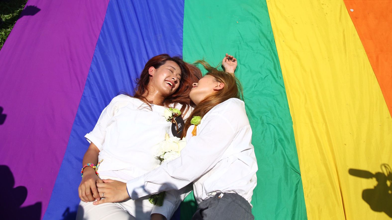 Amber Wang, right, and Kristin Huang, left, laugh after their marriage as Taiwan passes historical same-sex marriage law, making it the first nation in Asia.