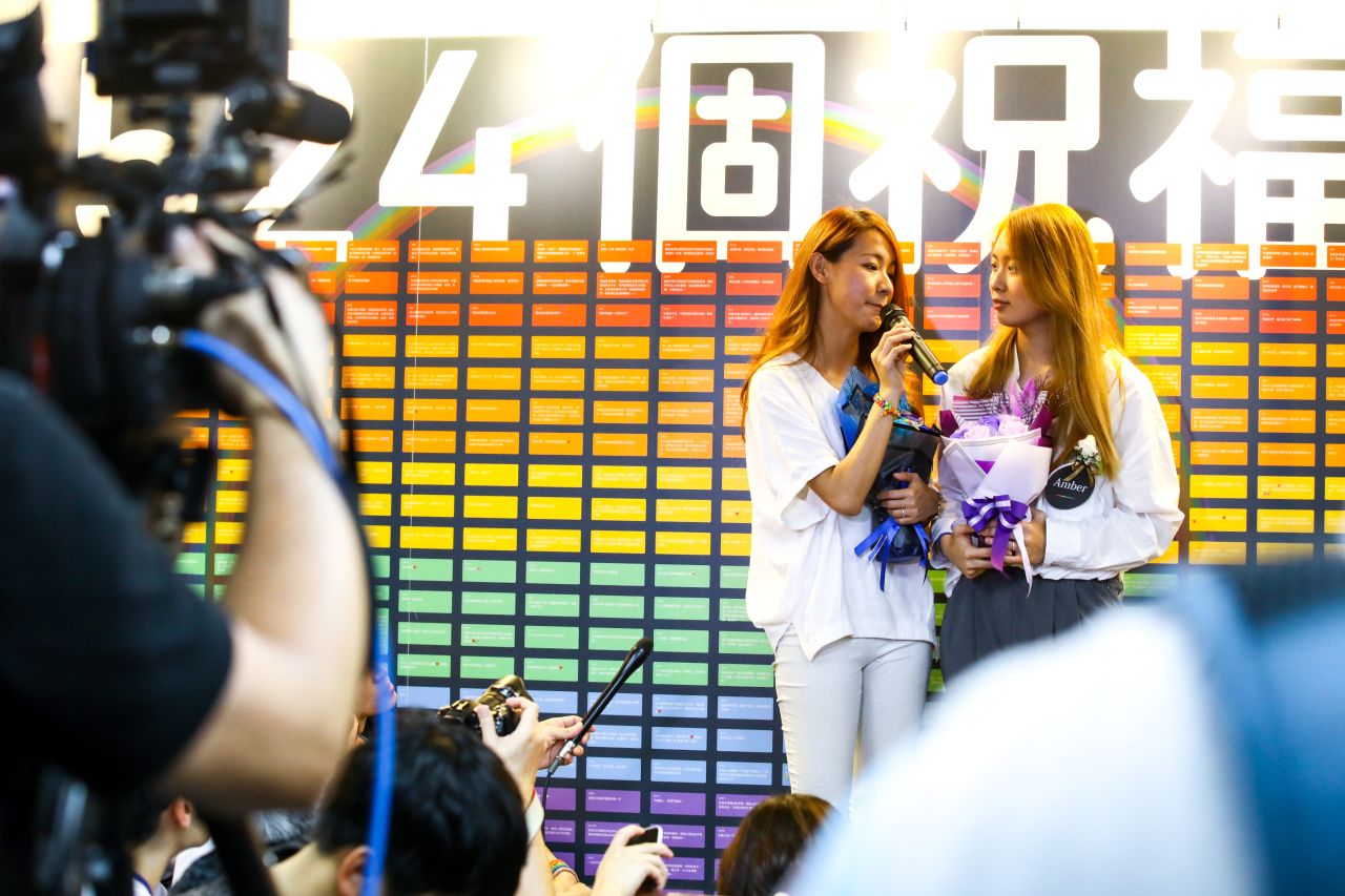 Kristin Huang, left, and Amber Wang, right, talk about their relationship during a press interview.