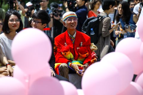 Gay rights activist Chi Chia-wei shows up at the same-sex wedding party on Friday in Taipei.