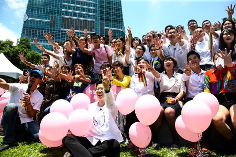 Marriage Equality Coalition Taiwan (the Coalition) poses for a photo with the Department of Civil Affairs, Taipei City Government to throw a same-sex wedding party on Friday in Taipei.