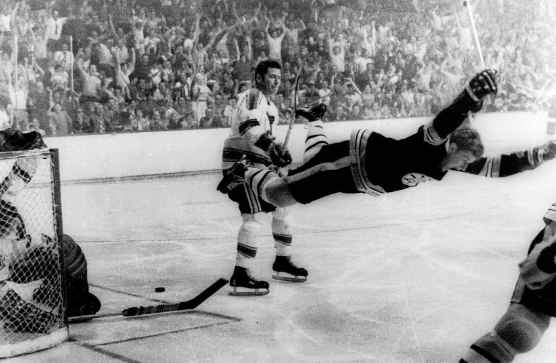 In an iconic hockey photo, Bobby Orr dives into the air after scoring against the St. Louis Blues on May 10, 1970. The goal clinched the Stanley Cup for the Boston Bruins.