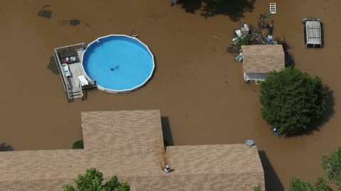 An aerial image shows the extent of flooding in Sand Springs, west of Tulsa.